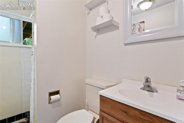 4710 Cheerful Road Colorado Springs, CO 80917 - Photo 17 of 28 Full bath with vanity and toilet