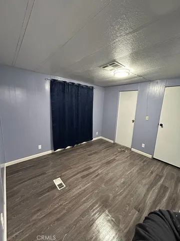 an empty room with a wooden door