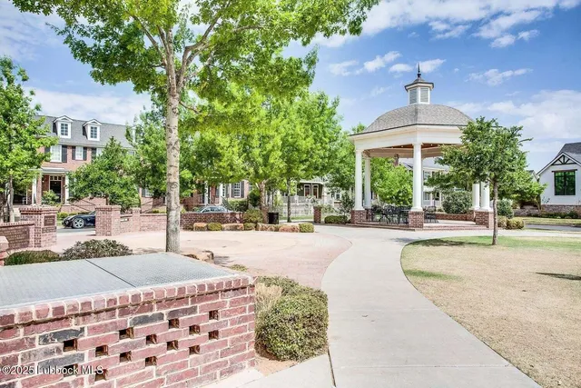 a building exterior with stairs and bench