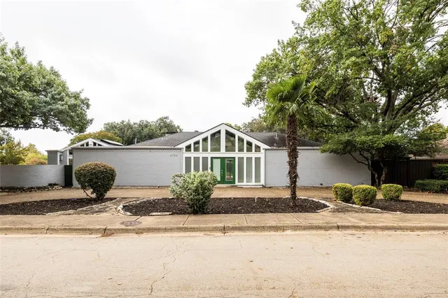 a front view of a house with yard