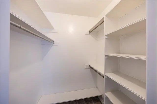 a view of an empty walk in closet