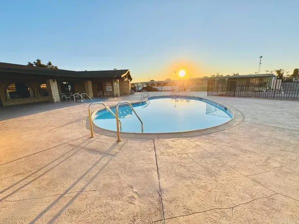 a view of a swimming pool with a lounge chairs