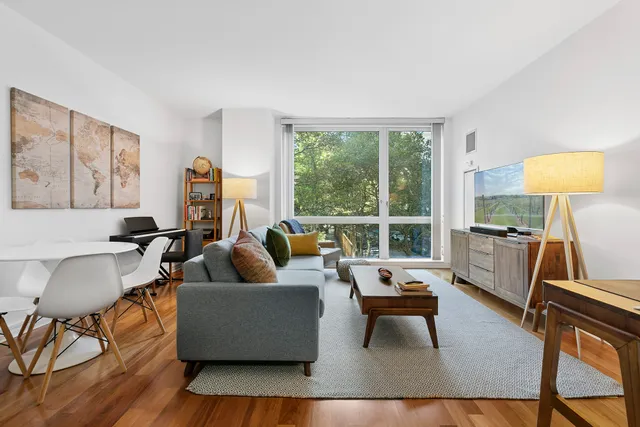 a living room with furniture and a large window