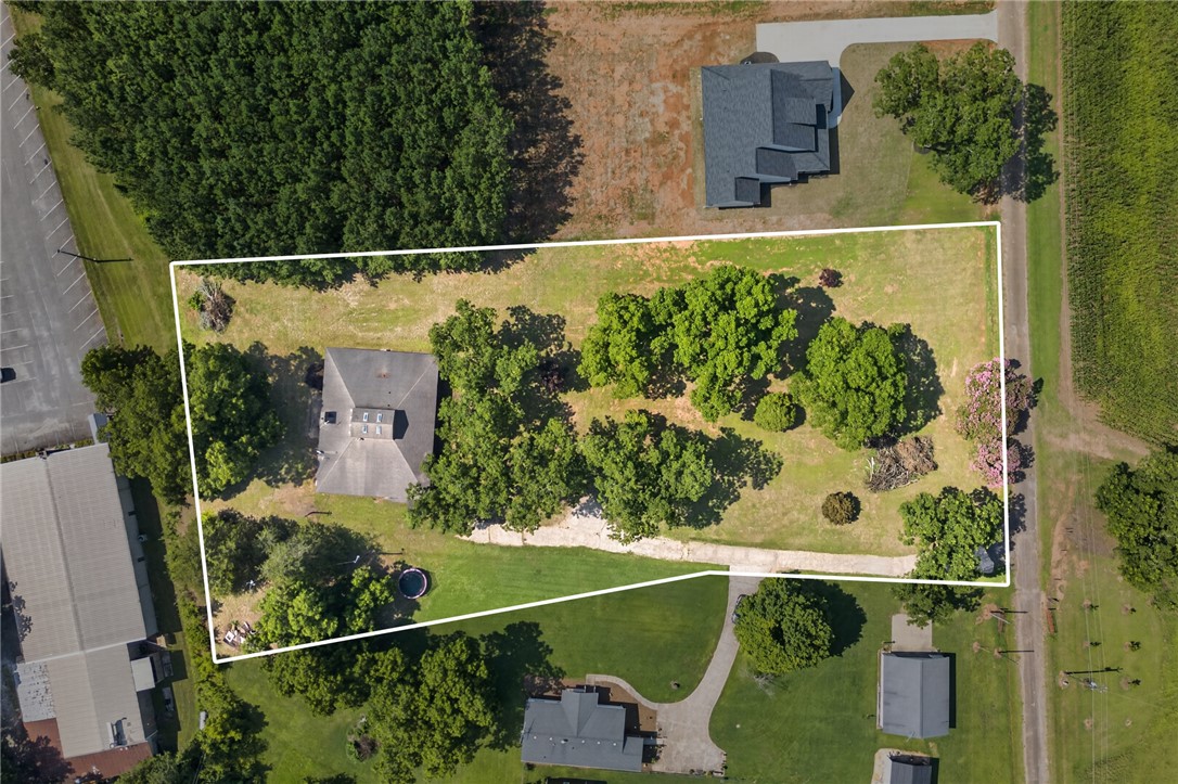 1412 Simpson Road Pendleton, SC 29670 - Photo 38 of 48 An aerial perspective reveals a private, expansive lot with mature trees, offering a tranquil rural setting.