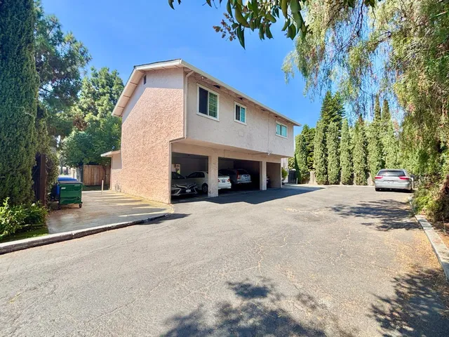 a view of a house with a yard and garage