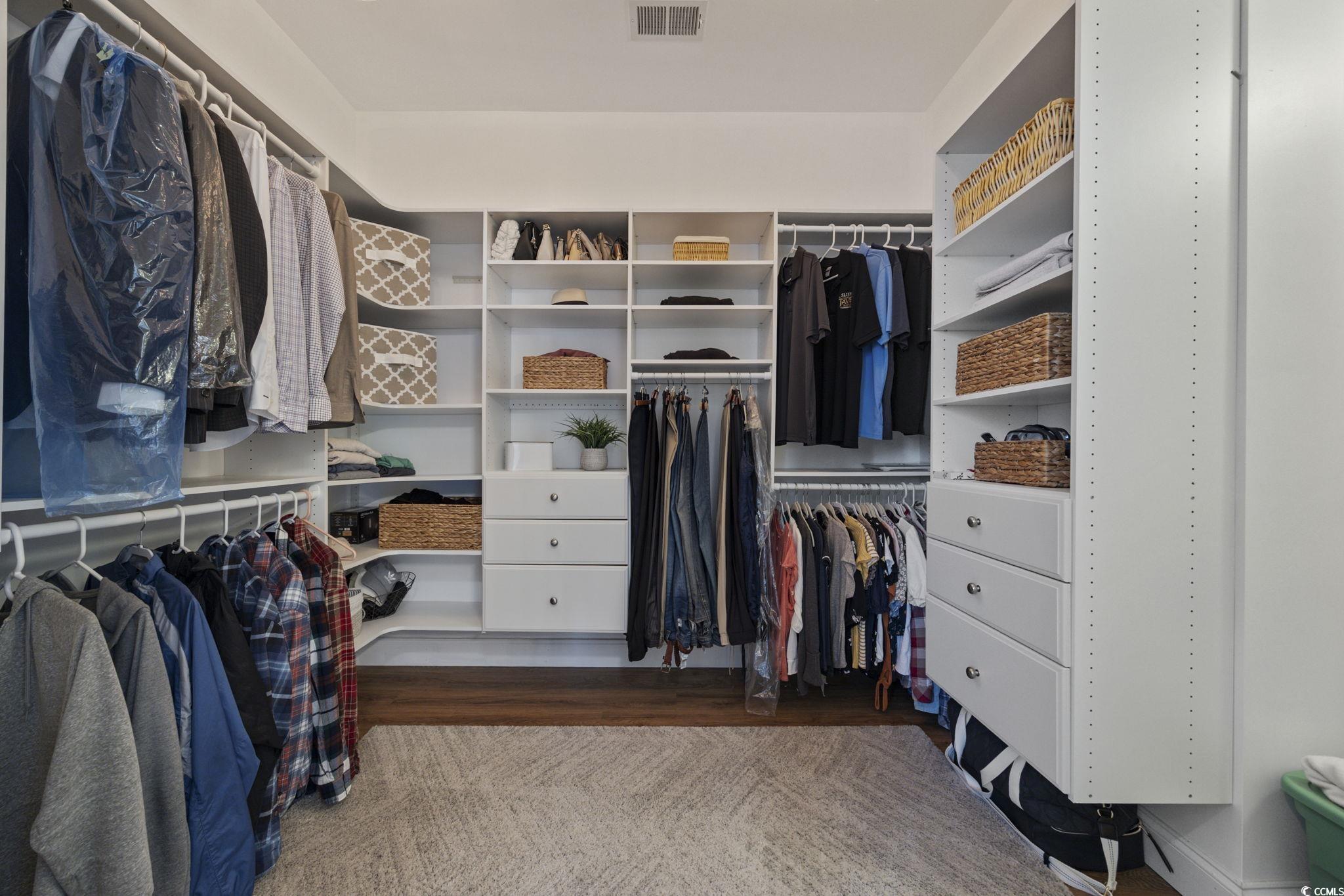 147 Hyacinth Loop Murrells Inlet, SC 29576 - Photo 16 of 40 Walk in closet with light wood finished floors