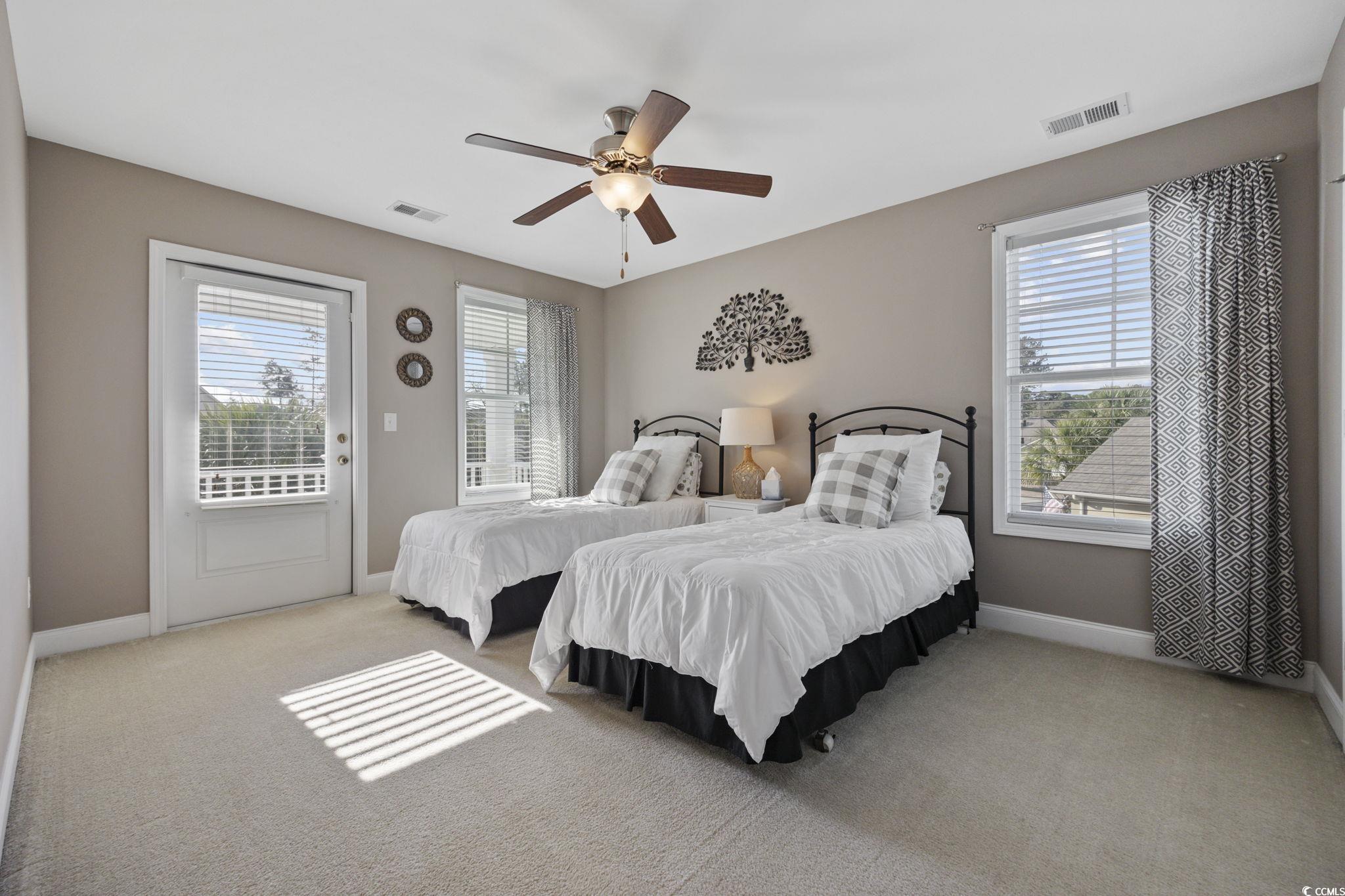 147 Hyacinth Loop Murrells Inlet, SC 29576 - Photo 22 of 40 Bedroom with access to outside, light carpet, and ceiling fan