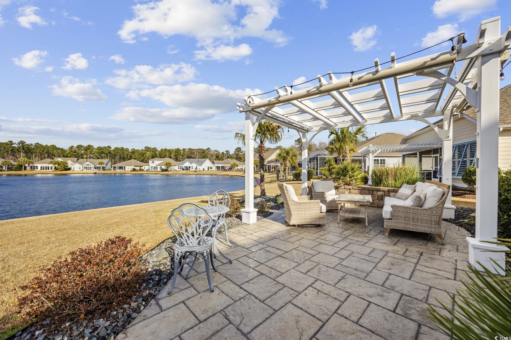 147 Hyacinth Loop Murrells Inlet, SC 29576 - Photo 29 of 40 View of patio / terrace featuring a pergola, a water view, a residential view, and an outdoor living space