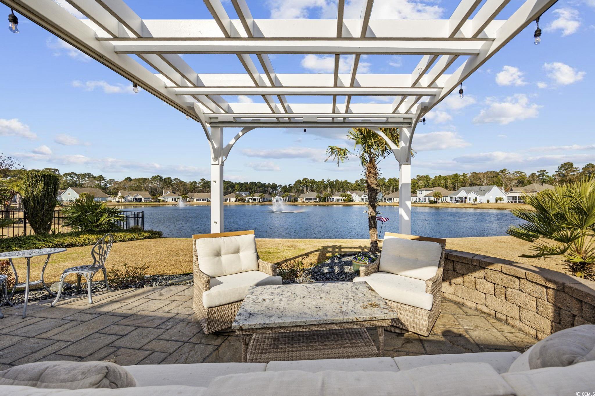 147 Hyacinth Loop Murrells Inlet, SC 29576 - Photo 30 of 40 View of patio / terrace with a water view and a pergola