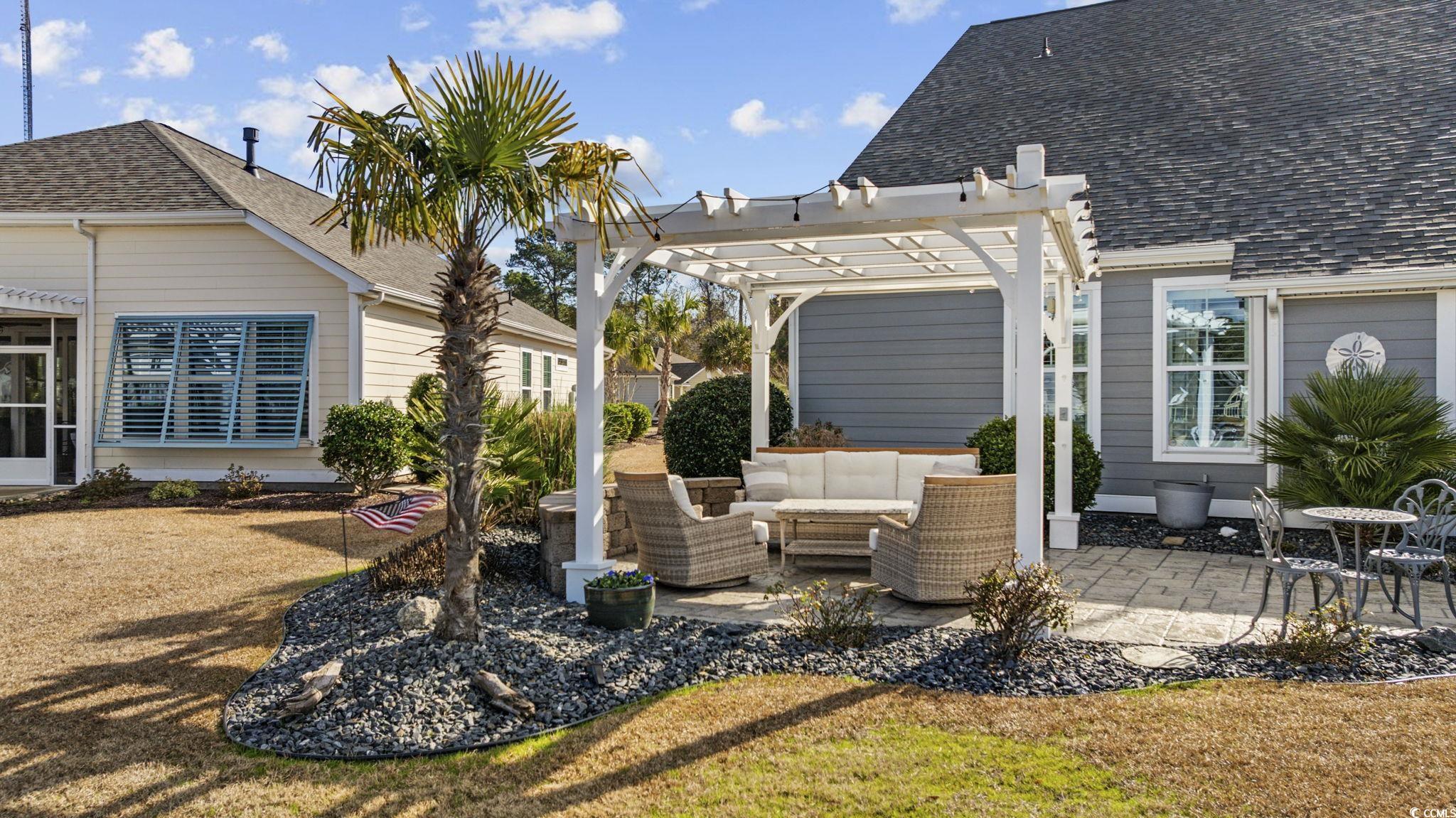 147 Hyacinth Loop Murrells Inlet, SC 29576 - Photo 31 of 40 View of patio with a pergola and an outdoor living space
