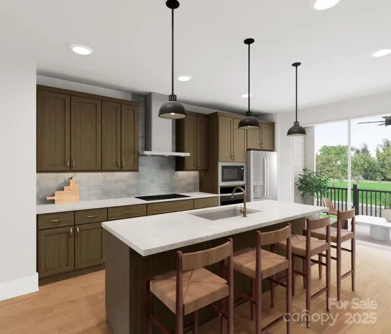 a kitchen with a table chairs sink and cabinets