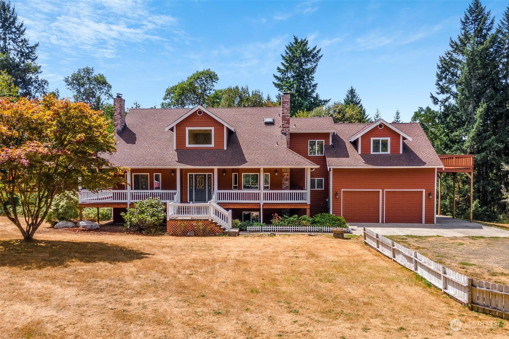 3321 Whiteman Road Southwest Longbranch, WA 98349 - Photo 1 of 40 a front view of a house with a yard