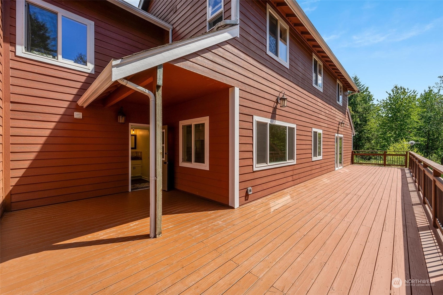 3321 Whiteman Road Southwest Longbranch, WA 98349 - Photo 23 of 40 a backyard of a house with wooden floor