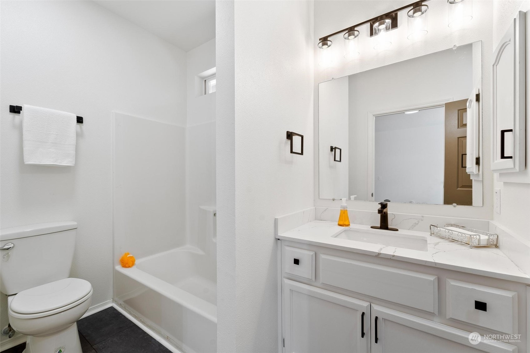 3321 Whiteman Road Southwest Longbranch, WA 98349 - Photo 25 of 40 a bathroom with a sink a toilet and shower