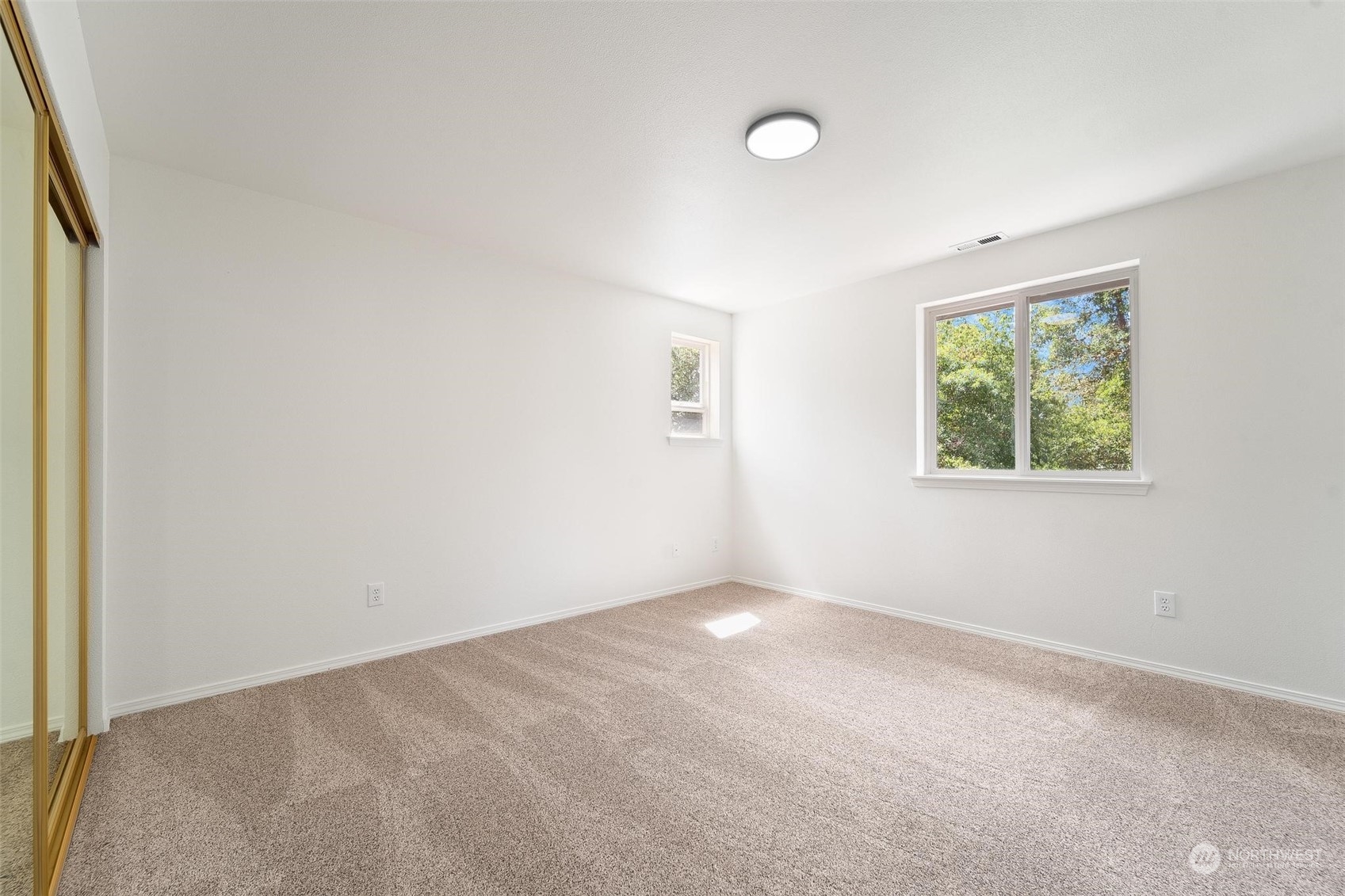 3321 Whiteman Road Southwest Longbranch, WA 98349 - Photo 28 of 40 an empty room with windows