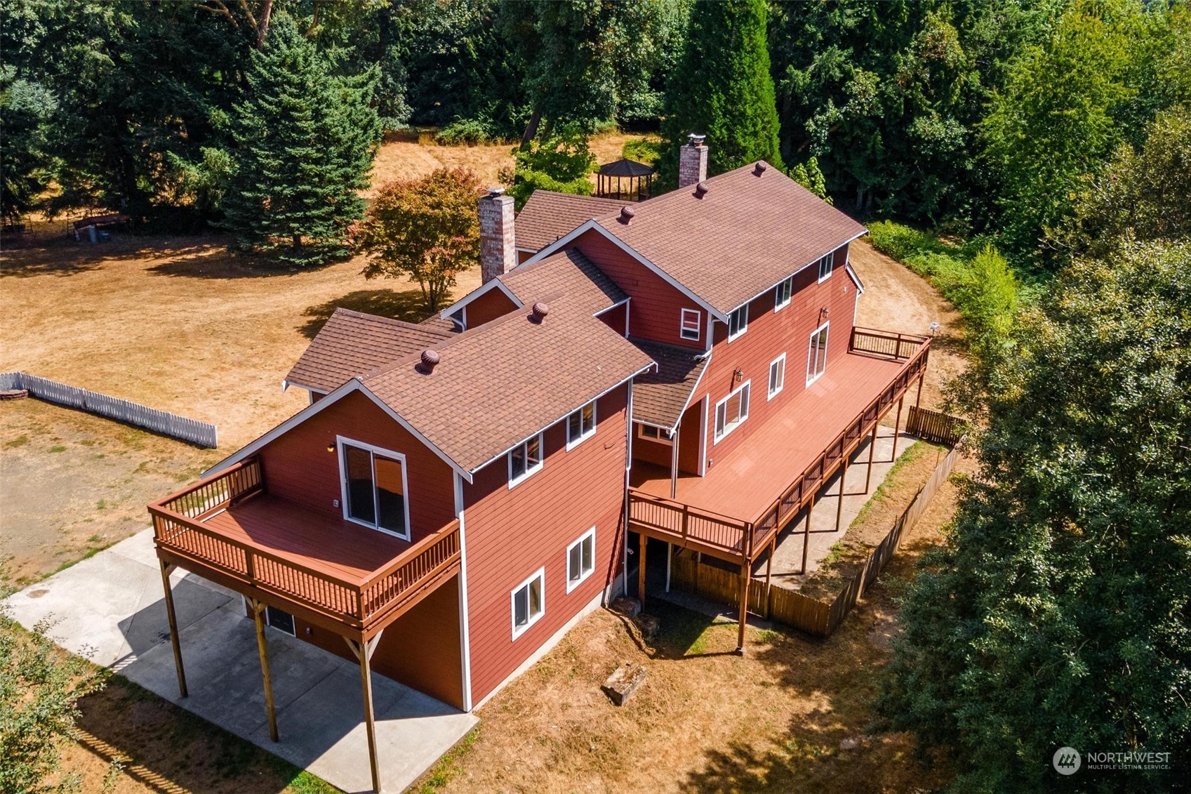 3321 Whiteman Road Southwest Longbranch, WA 98349 - Photo 3 of 40 an aerial view of a house with a yard and balcony