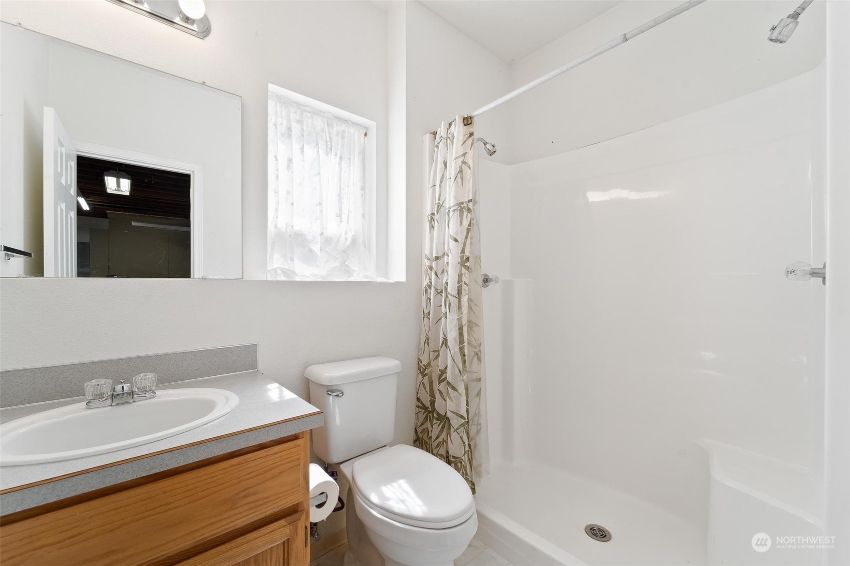 3321 Whiteman Road Southwest Longbranch, WA 98349 - Photo 37 of 40 a bathroom with a sink a toilet and shower