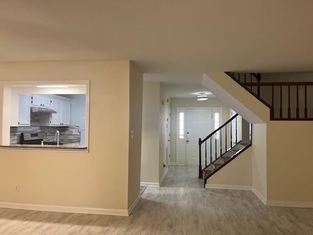 5950 WinterGreen Road Northwest Norcross, GA 30093 - Photo 15 of 33 a view of a hallway with kitchen and dining room