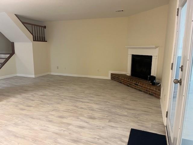 5950 WinterGreen Road Northwest Norcross, GA 30093 - Photo 16 of 33 a view of a livingroom with wooden floor and a ceiling fan