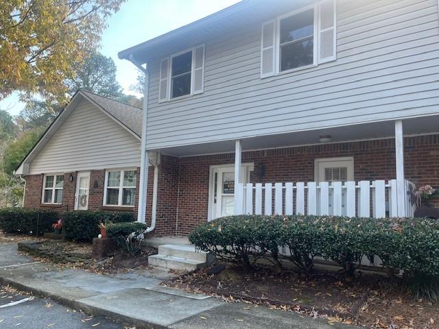 5950 WinterGreen Road Northwest Norcross, GA 30093 - Photo 2 of 33 a front view of a house with yard and sitting area