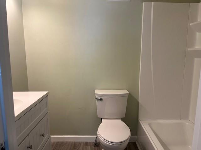 5950 WinterGreen Road Northwest Norcross, GA 30093 - Photo 31 of 33 a white toilet sitting next to a bathroom sink