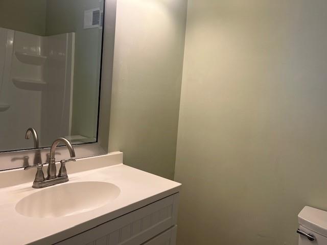 5950 WinterGreen Road Northwest Norcross, GA 30093 - Photo 32 of 33 a bathroom with a sink and a mirror