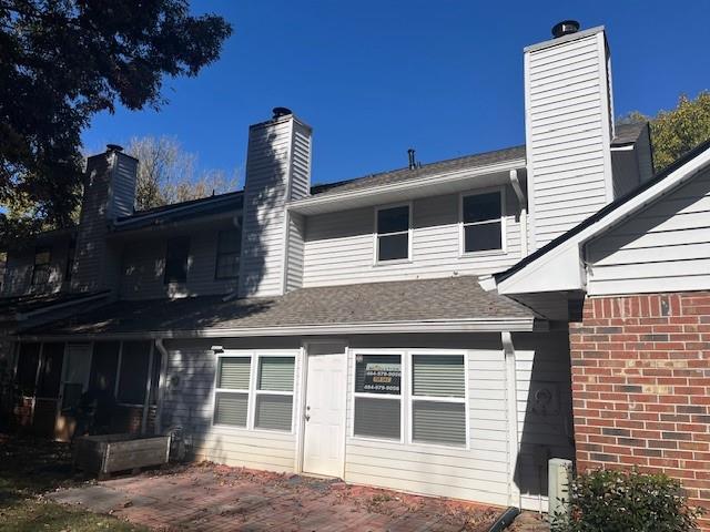 5950 WinterGreen Road Northwest Norcross, GA 30093 - Photo 8 of 33 a front view of a house with a garden