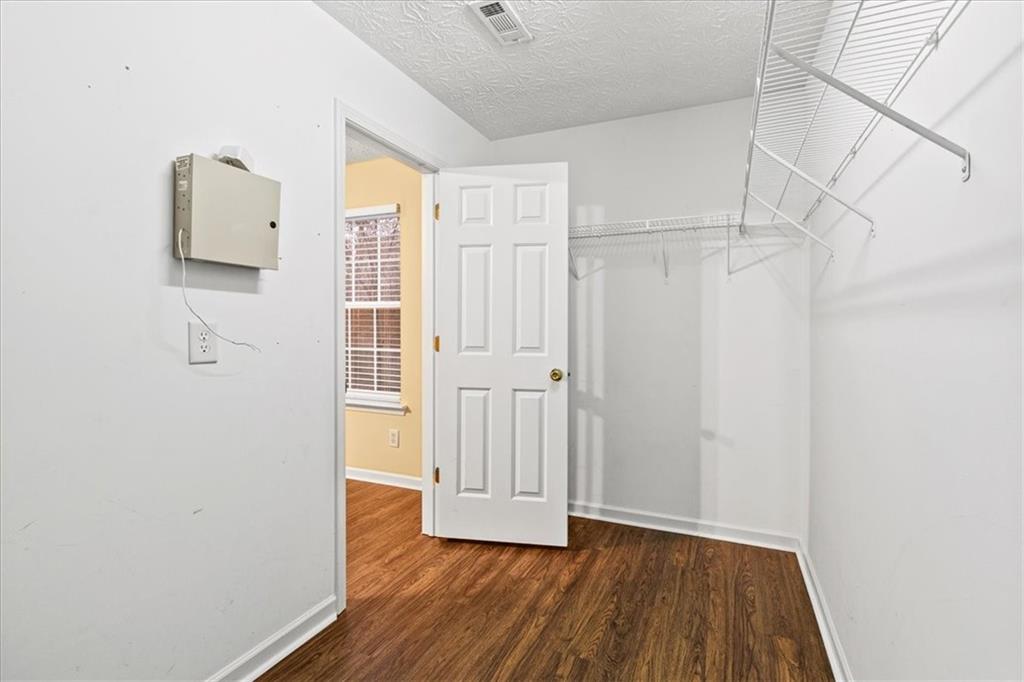329 Meadows Lane Canton, GA 30114 - Photo 20 of 36 a view of an empty room with wooden floor and a window