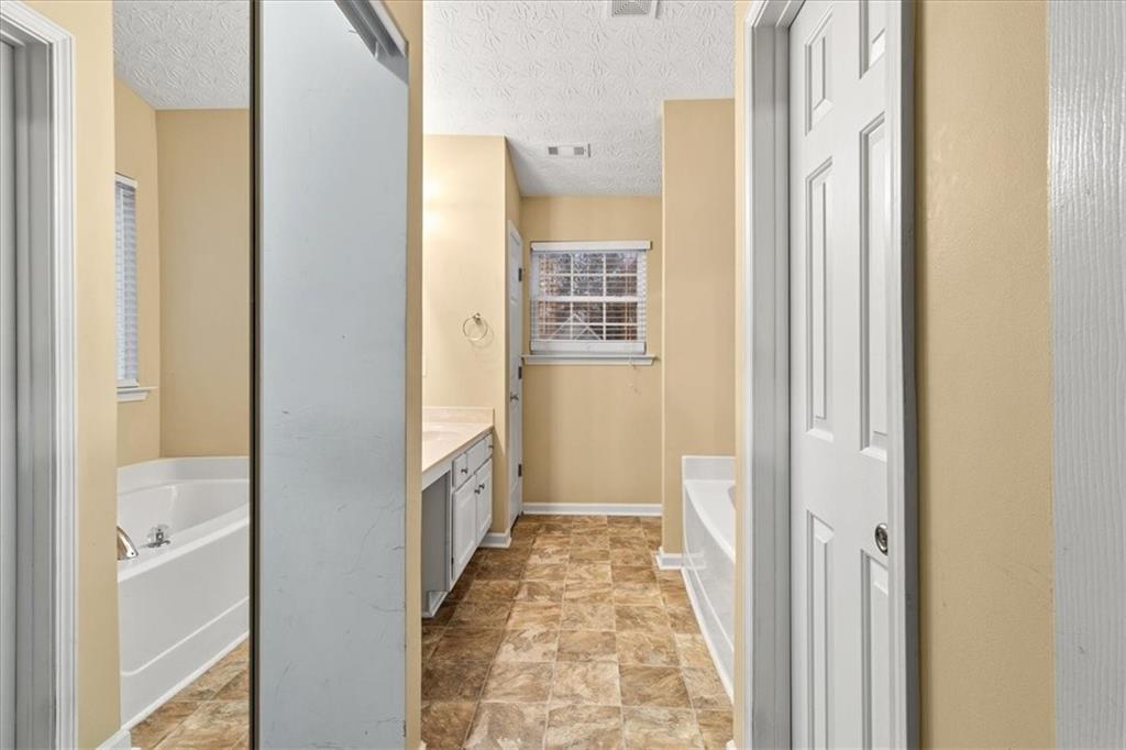 329 Meadows Lane Canton, GA 30114 - Photo 21 of 36 a view of a hallway with wooden floor and staircase