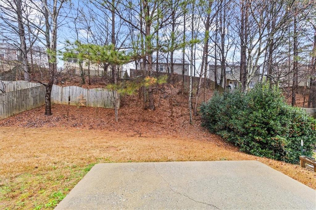 329 Meadows Lane Canton, GA 30114 - Photo 32 of 36 a view of a yard with plants and trees