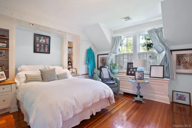 a bed room with bed and a window