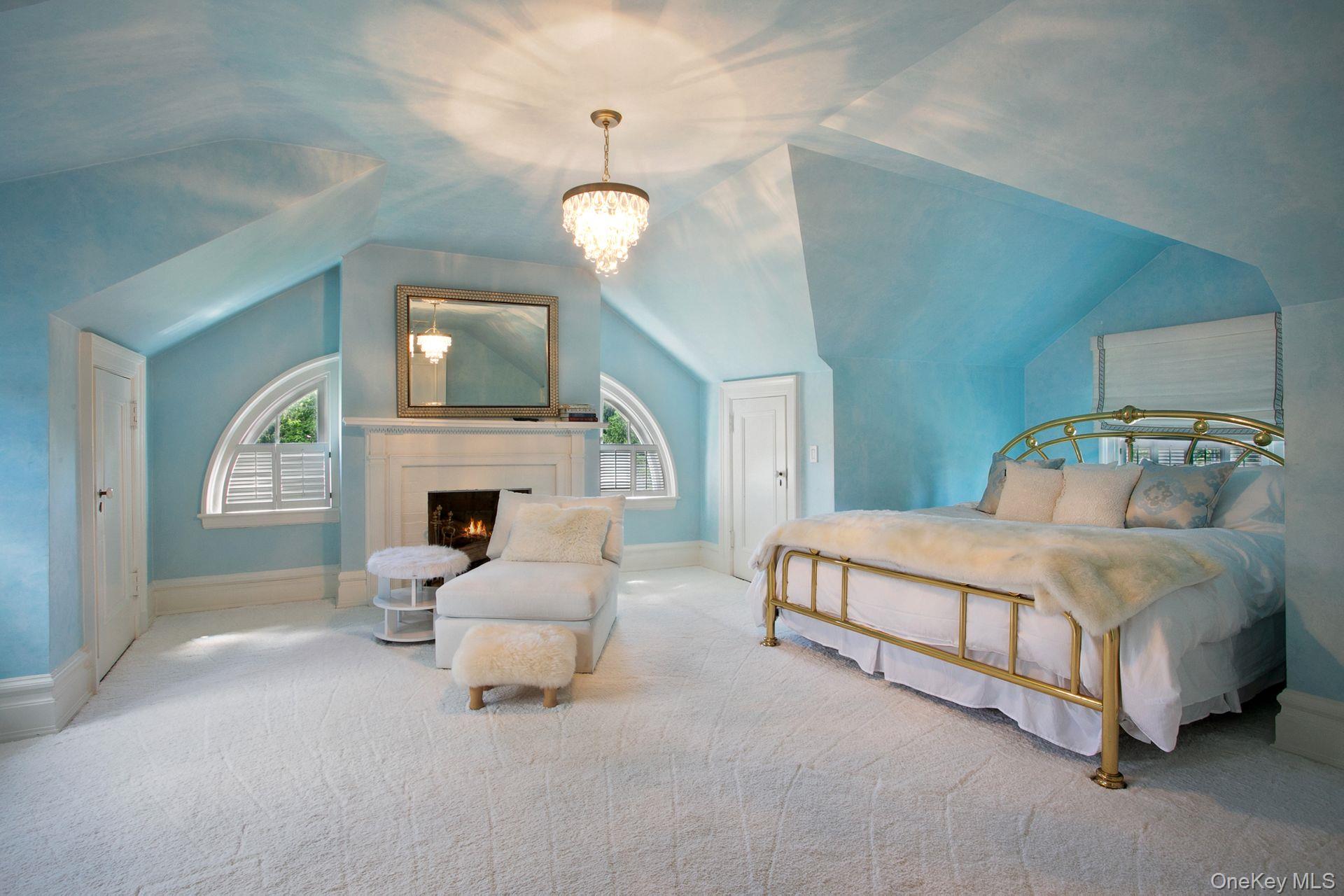 1 Roland Road Irvington, NY 10533 - Photo 25 of 35 a spacious bedroom with a bed fireplace and window