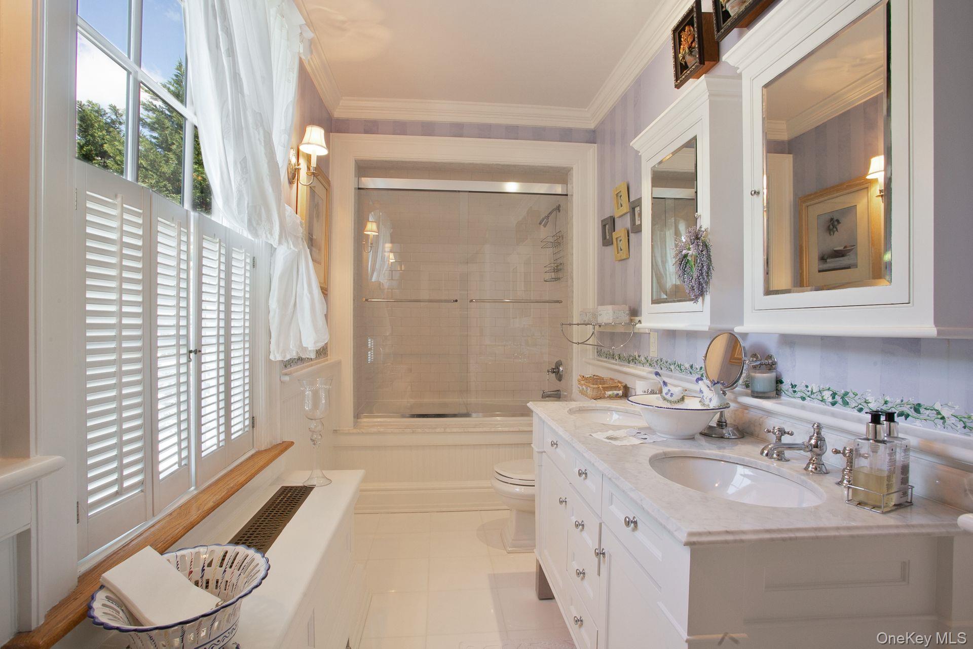 1 Roland Road Irvington, NY 10533 - Photo 26 of 35 a bathroom with a sink vanity granite tub and shower