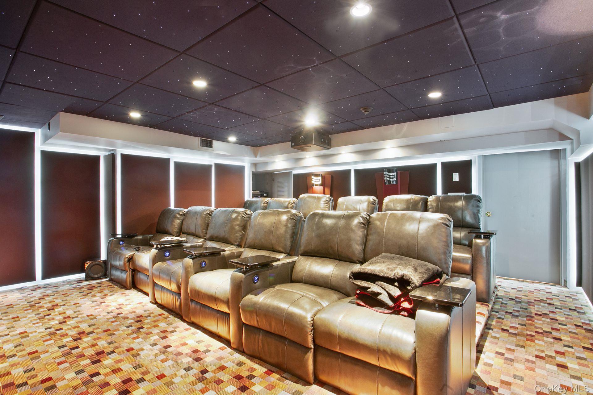 1 Roland Road Irvington, NY 10533 - Photo 28 of 35 a media room with lots of chairs and a wooden floor