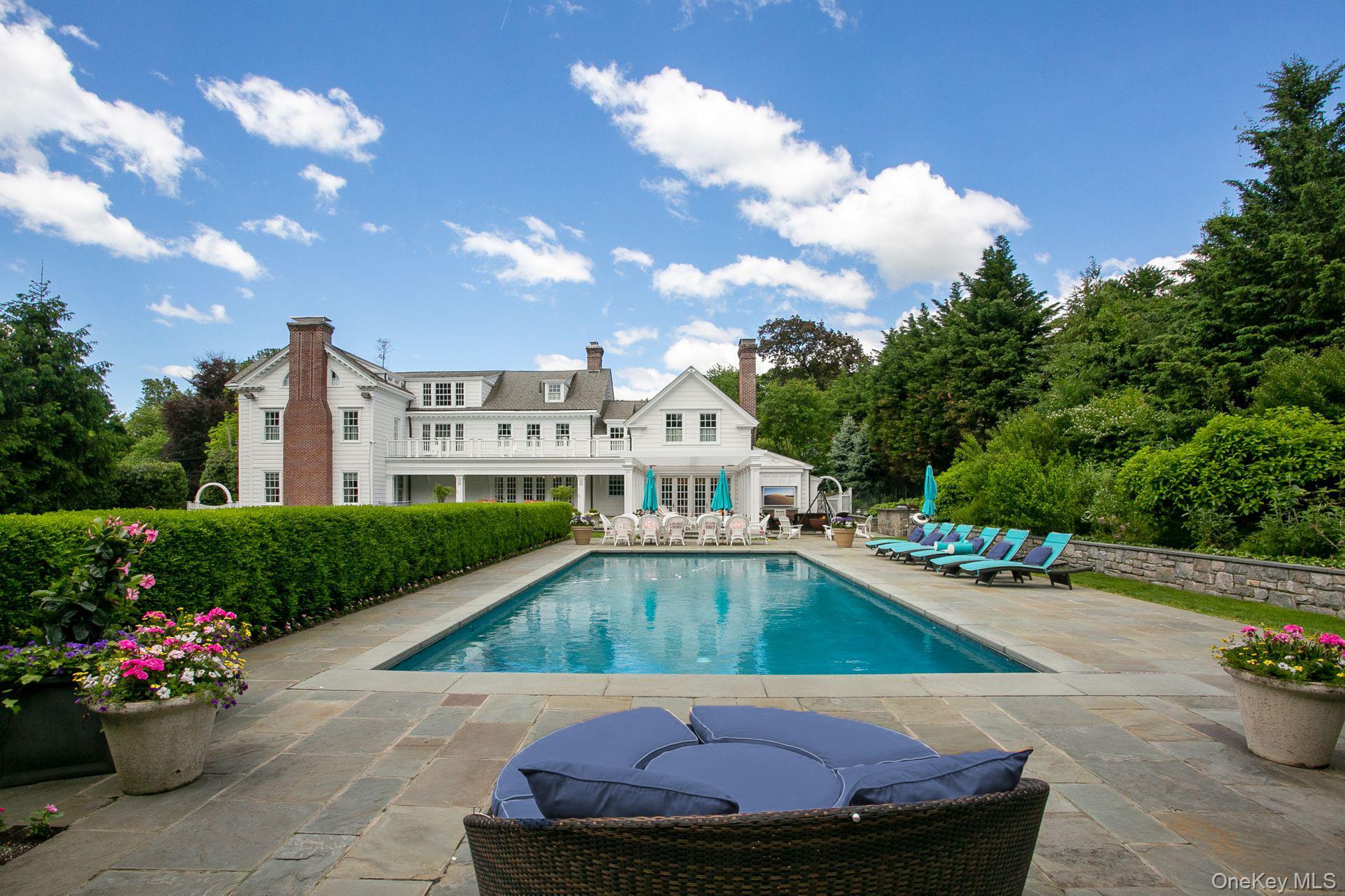 1 Roland Road Irvington, NY 10533 - Photo 30 of 35 a view of a house with swimming pool and sitting area