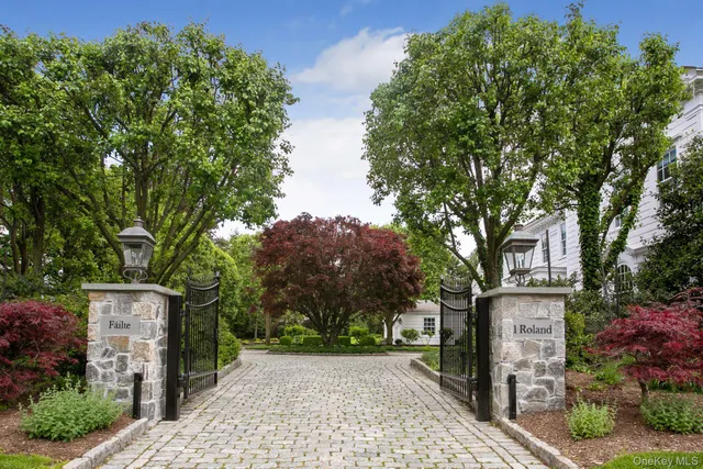 front view of a house with a tree