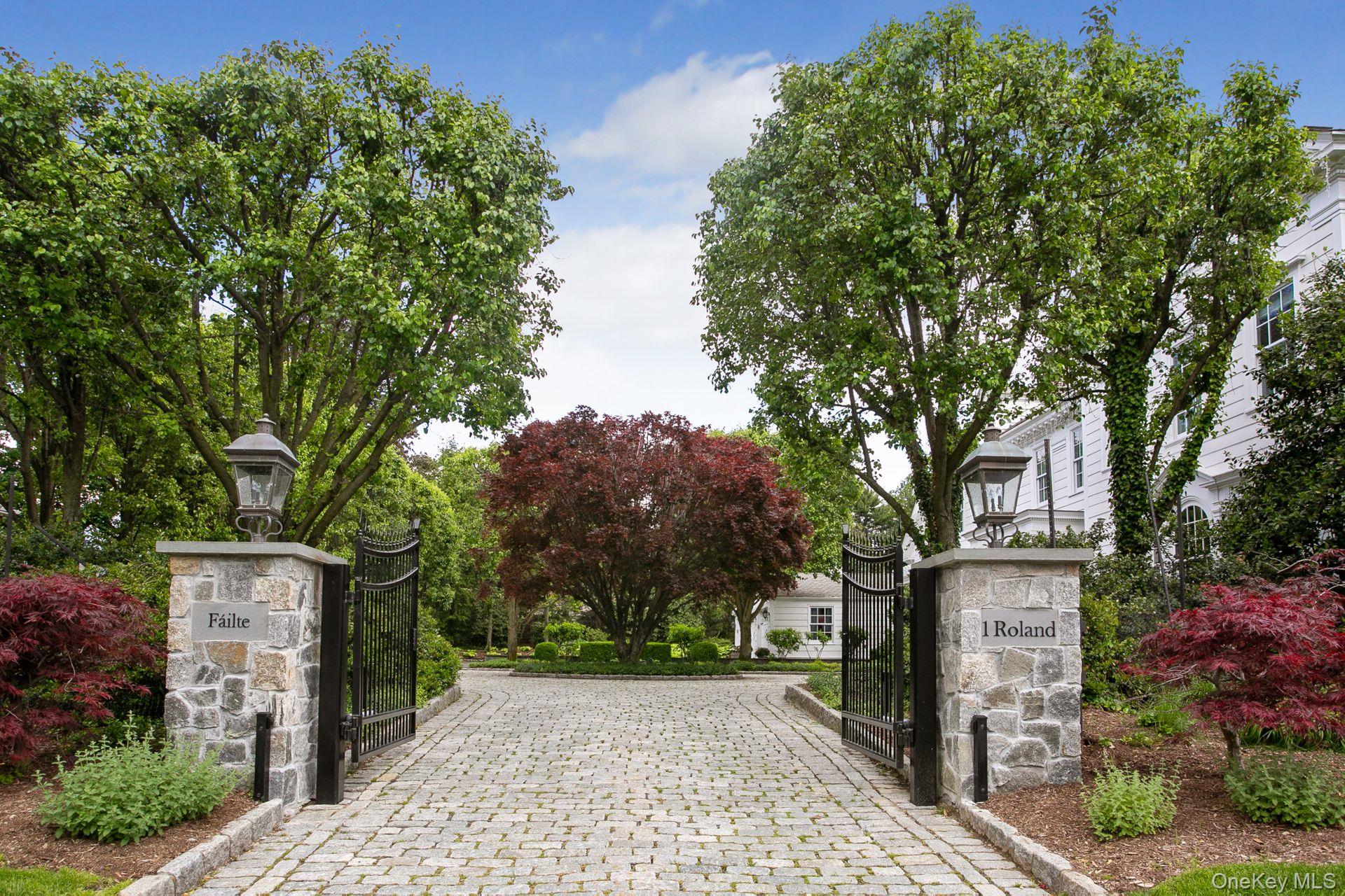 1 Roland Road Irvington, NY 10533 - Photo 3 of 35 front view of a house with a tree