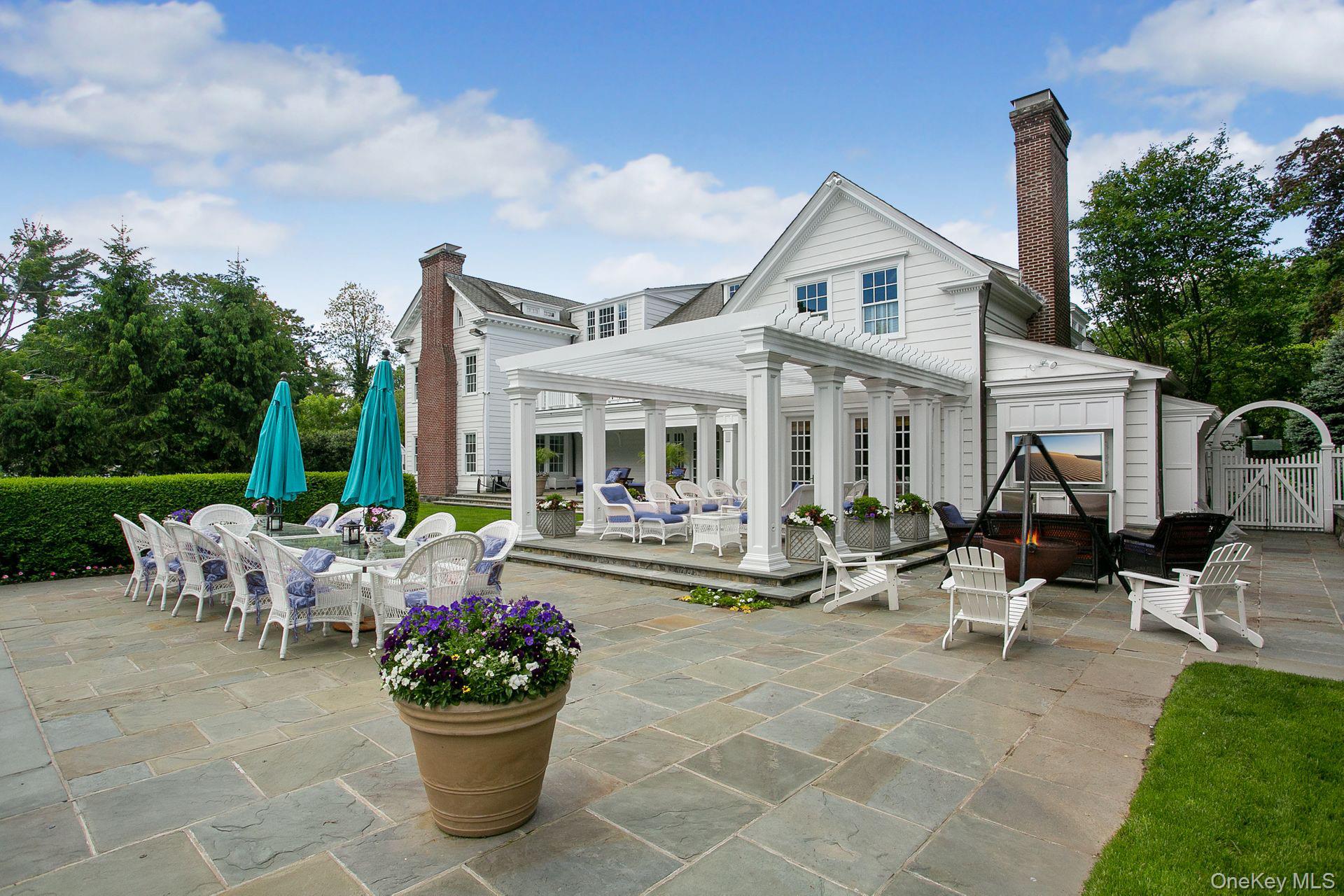 1 Roland Road Irvington, NY 10533 - Photo 43 of 49 a view of a house with backyard sitting area and garden