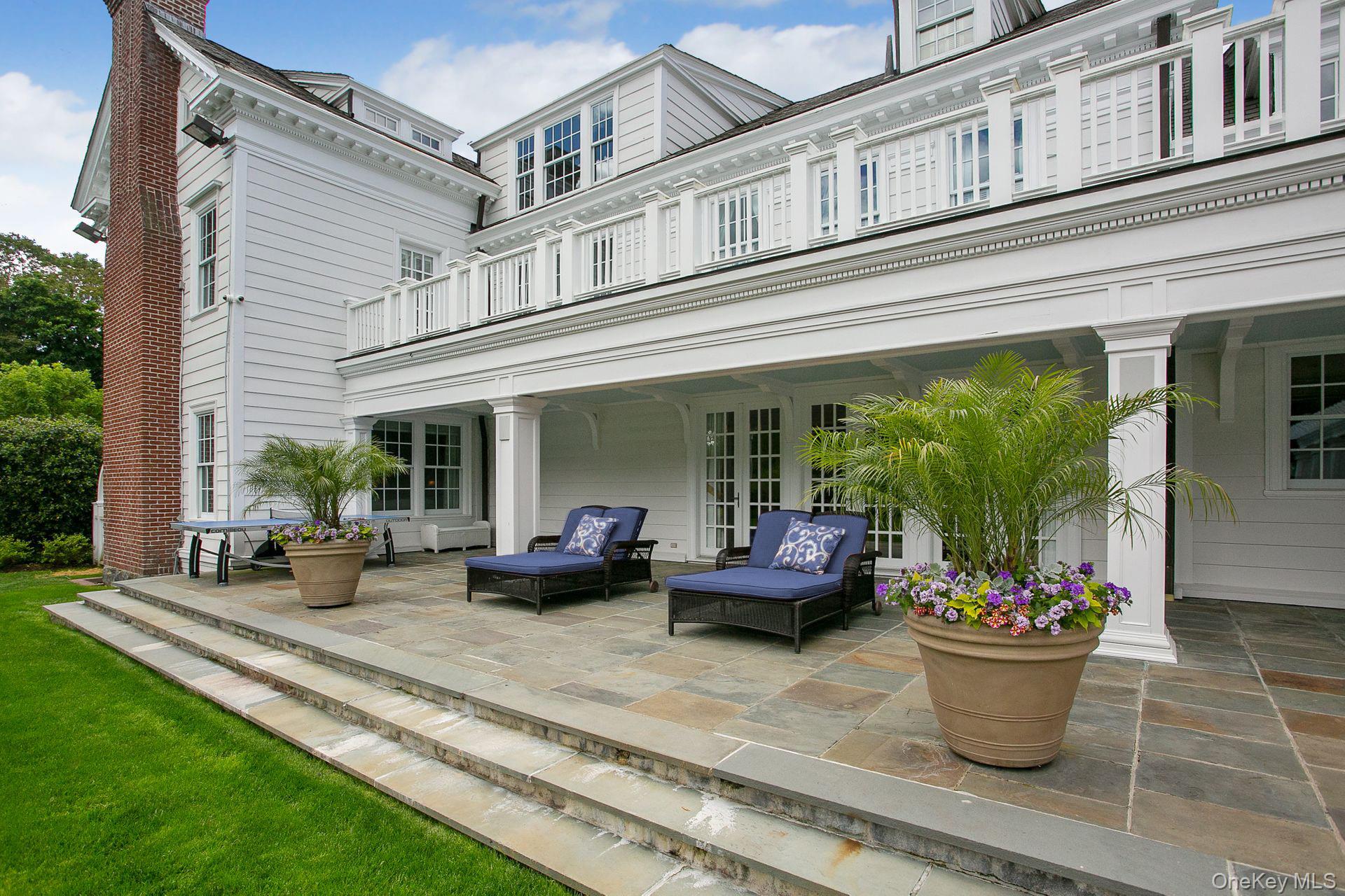 1 Roland Road Irvington, NY 10533 - Photo 46 of 49 a view of a patio with couches chairs and a potted plant