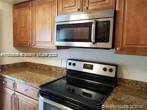 a view of swimming pool from a lounge chair
