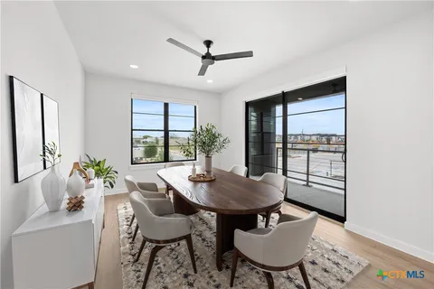 a view of kitchen with stainless steel appliances refrigerator oven and cabinets