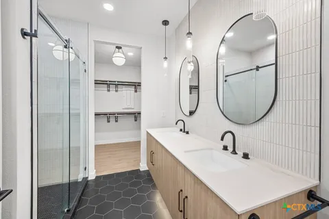 a bathroom with a sink and mirror