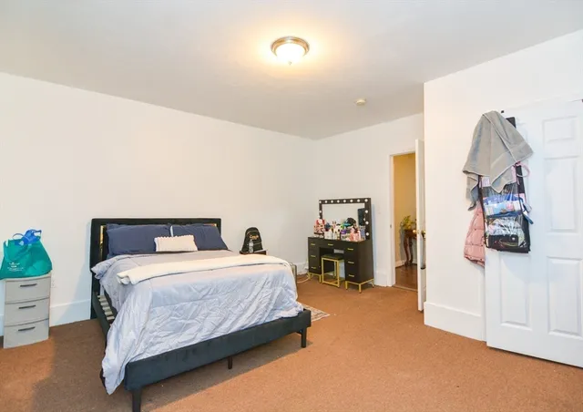 a bedroom with a bed and a closet