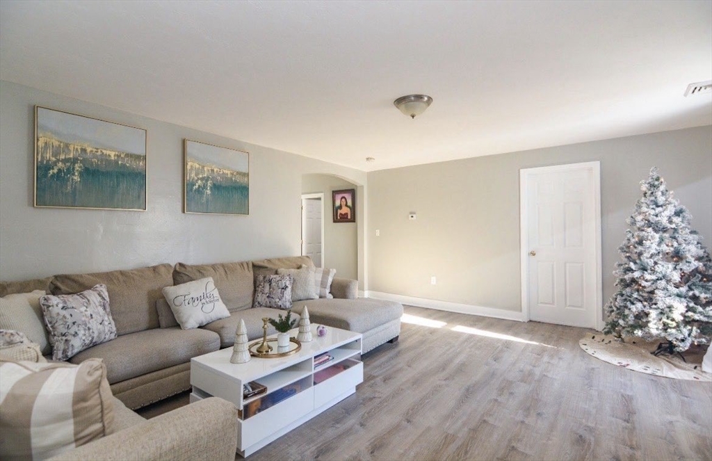 94 Summer Street Lawrence, MA 01840 - Photo 20 of 28 a living room with furniture and a couch