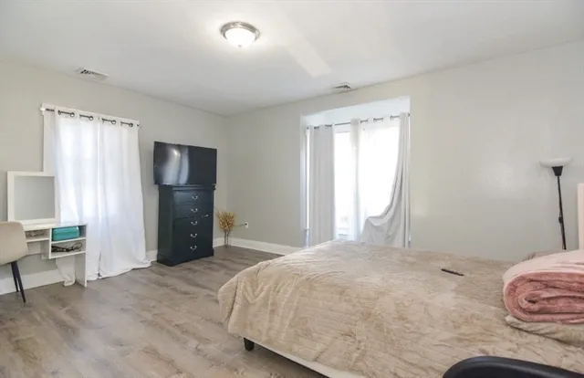 a bathroom with a toilet sink and shower