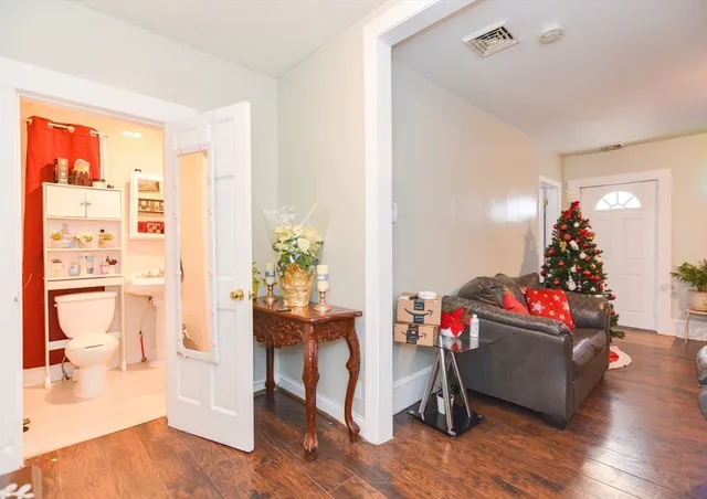 a bathroom with a sink a toilet and a shower