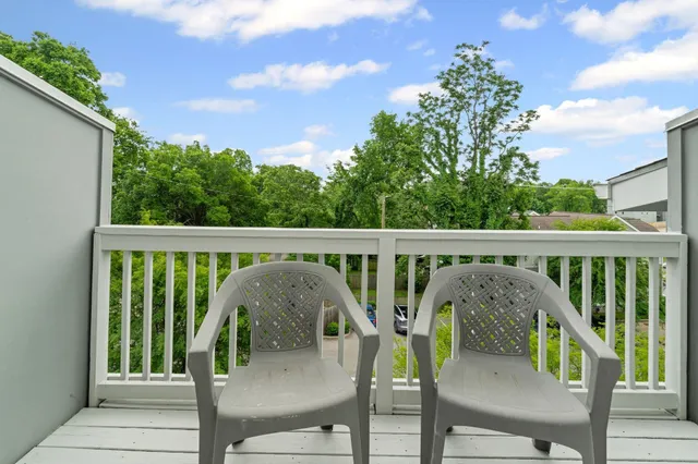 a view of balcony and outdoor seating