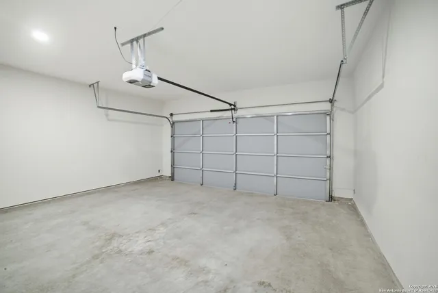 a view of a house with snow on the road