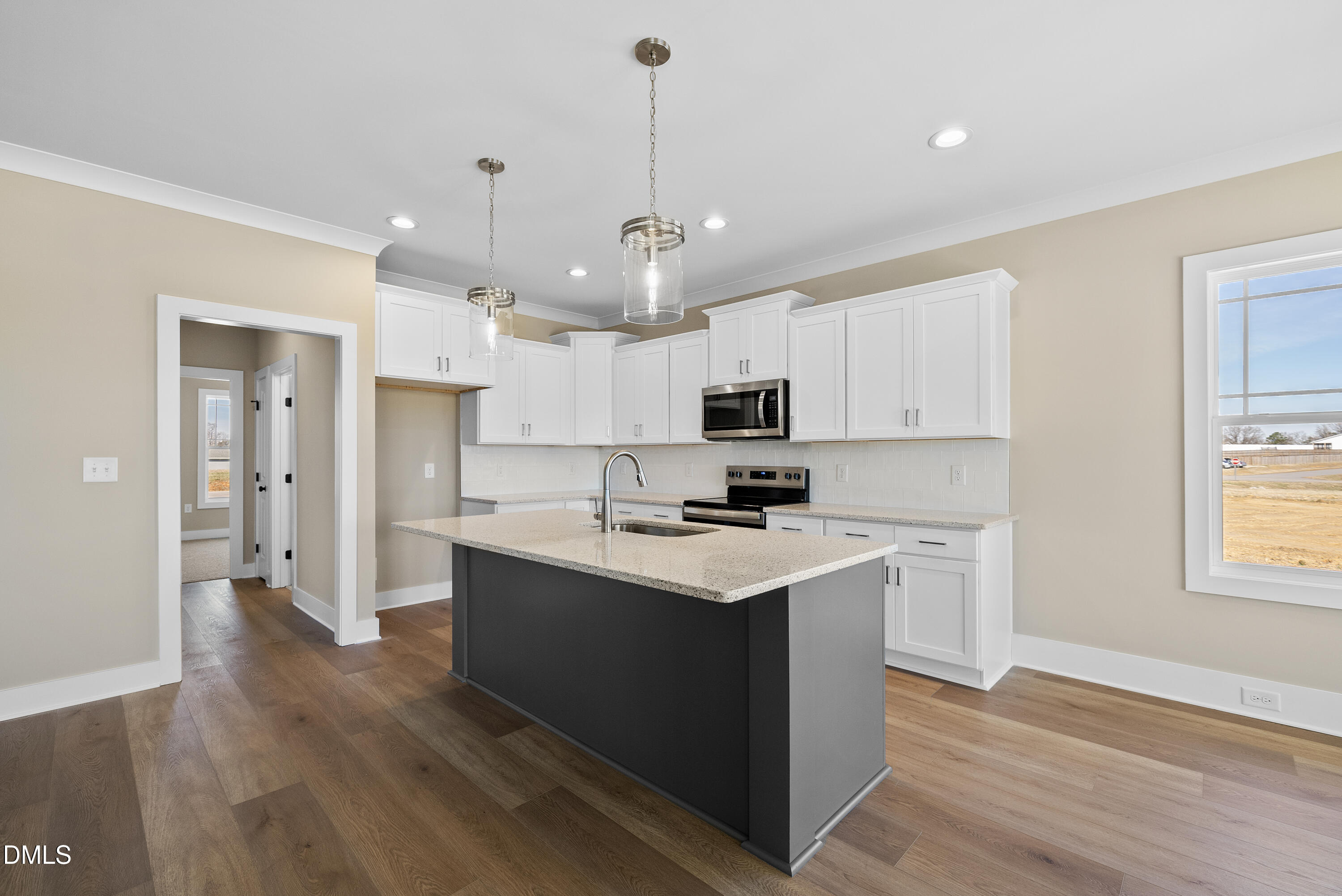 5549 River Buck Rd Spring Spring Hope, NC 27882 - Photo 5 of 35 a kitchen with stainless steel appliances kitchen island a sink dishwasher a refrigerator and a stove