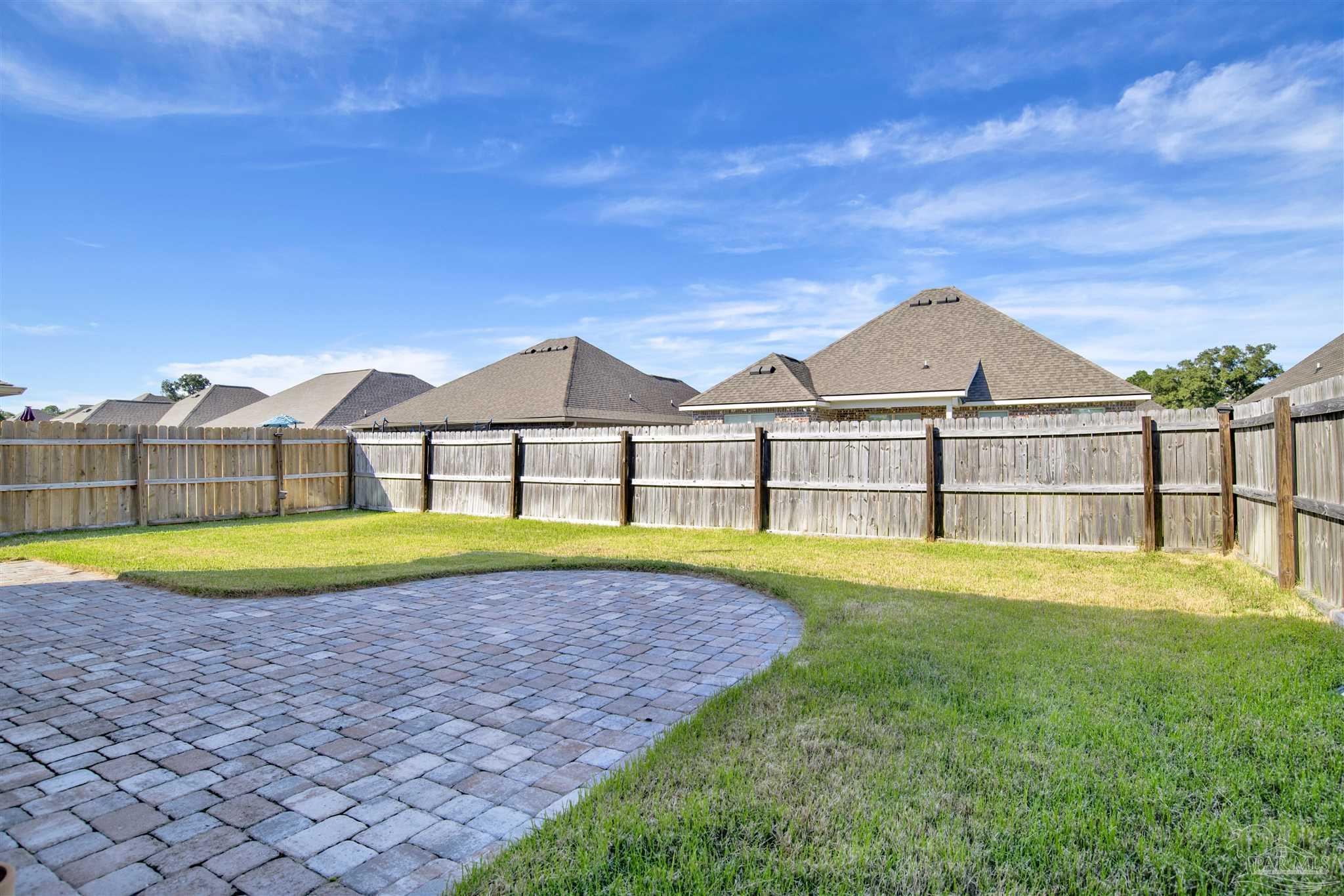 12295 Pinfish Road Pensacola, FL 32506 - Photo 31 of 34 a view of a house with a yard and sitting area
